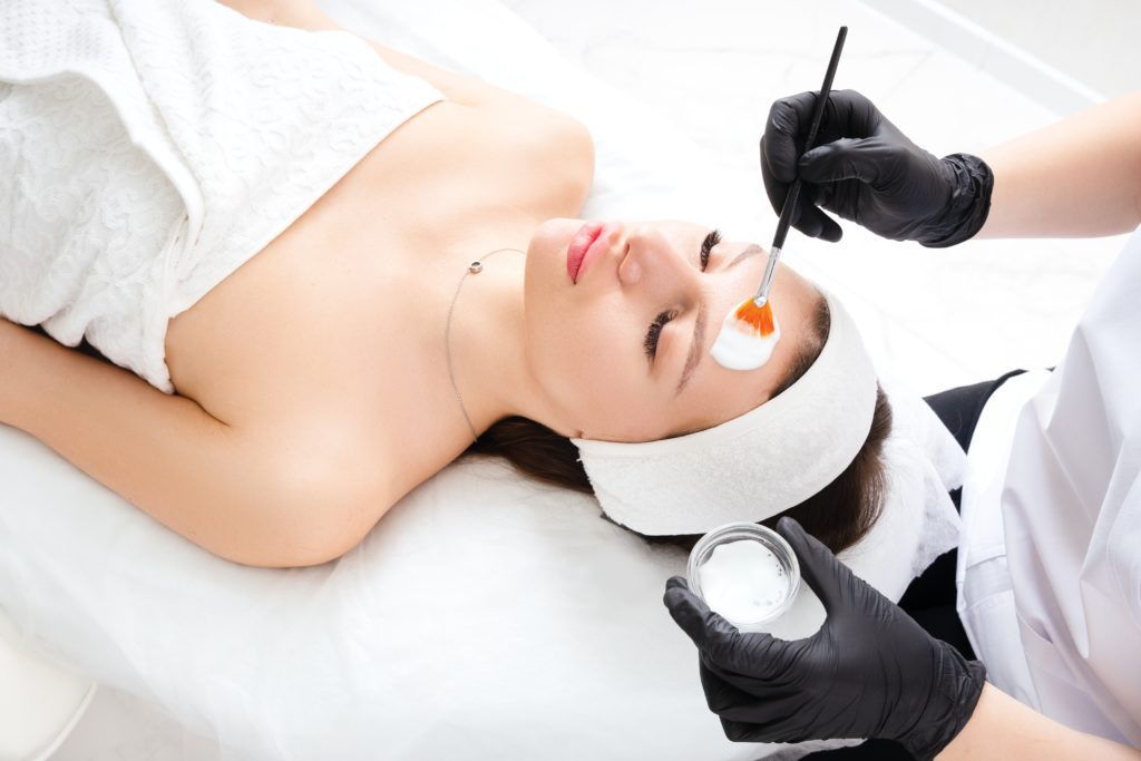 photo of a woman getting a chemical peel