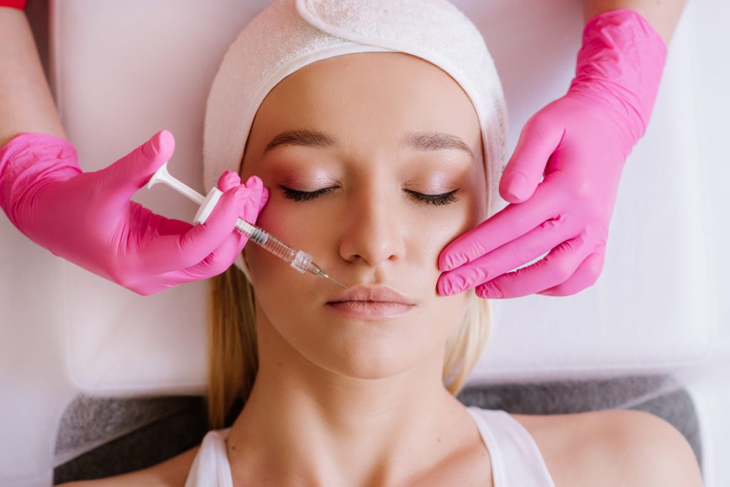 photo of woman getting dermal filler injection