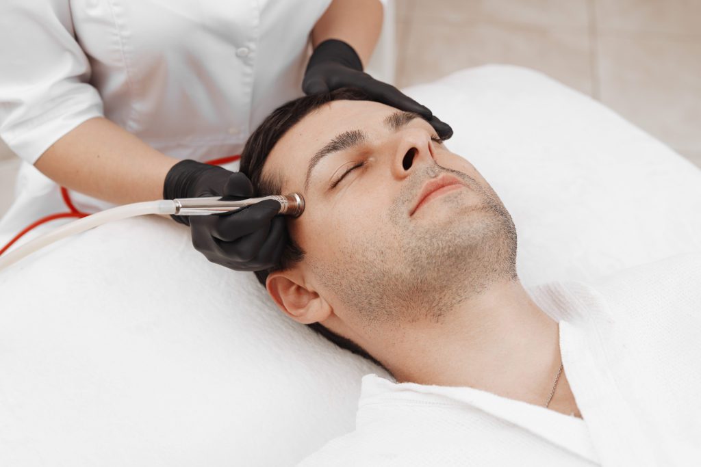man getting microdermabrasion treatment