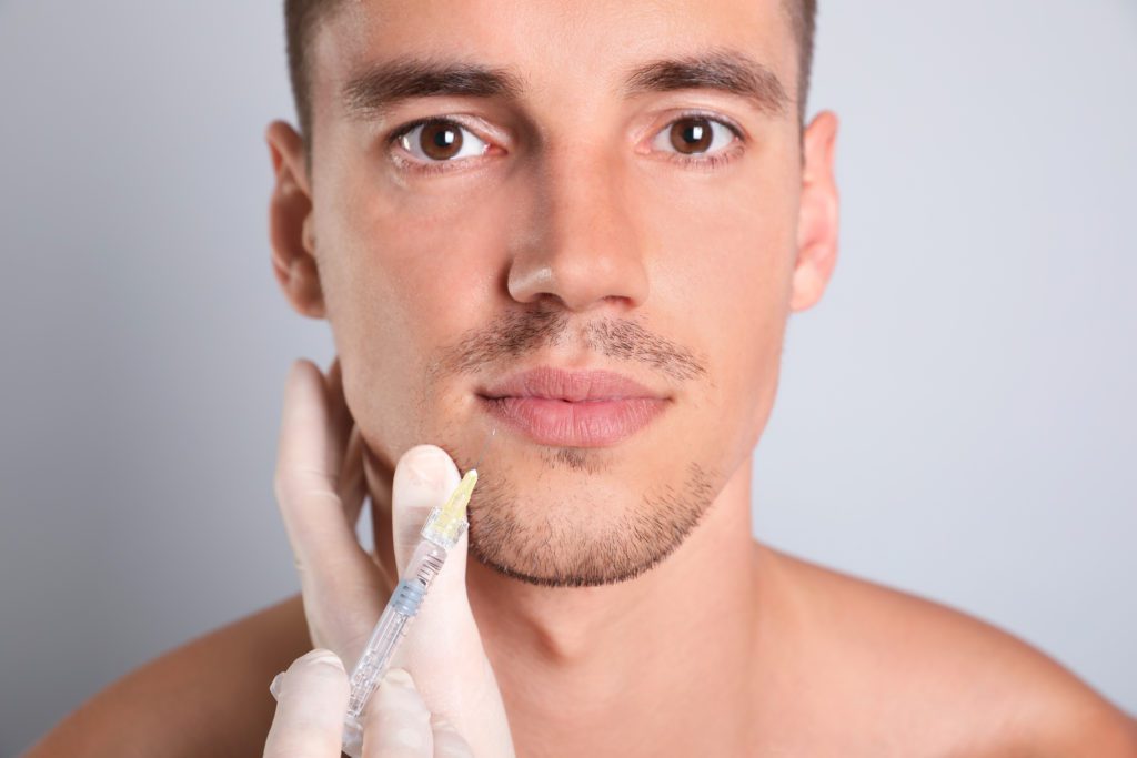 photo of man receiving dermal filler injection