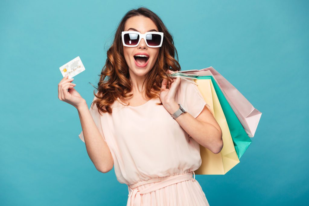 photo of a woman holding a gift card